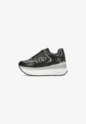 Sneaker platform nera con suola bianca, dettagli dorati, allacciatura frontale e logo in rilievo sul lato.