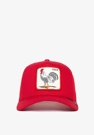 Red baseball cap featuring an embroidered patch of a rooster, outlined in orange, with the word "COCK" above the illustration.