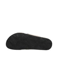 Black rubber shoe sole featuring a textured pattern with raised designs and logo detail. Flat shape with a rounded toe.