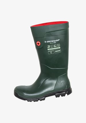 Grüner wasserdichter Gummistiefel mit rotem Innenfutter. Verfügt über eine strukturierte Oberfläche, verstärkte Spitze und eine tief profilierte Sohle für besseren Halt.