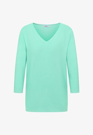 Muntgroene geribbelde gebreide trui met V-hals en driekwartmouwen, met het label "Cecil" aan de binnenkraag.