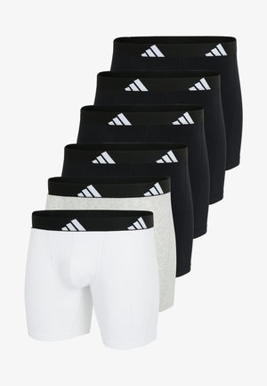 Set med sju boxershorts i svart, grått och vitt. Har elastiska midjeband med tre randig logotyp. Slätt, elastiskt tyg.