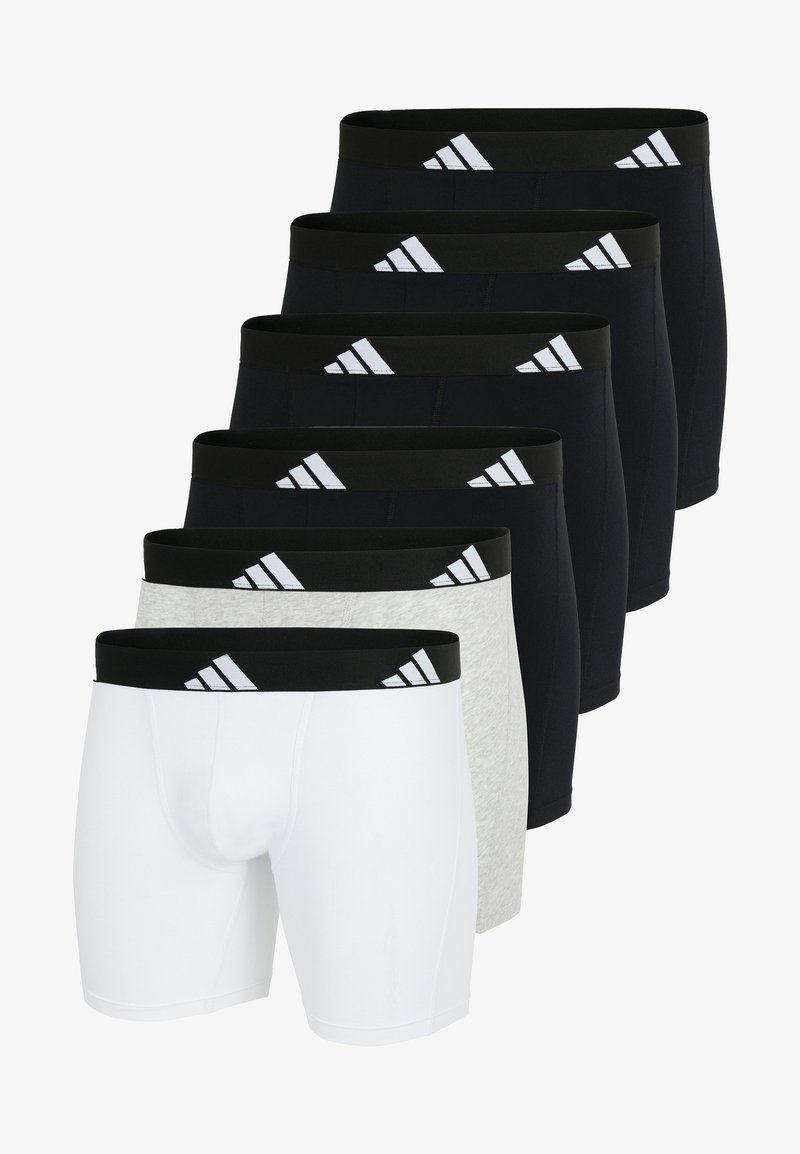 Set med sju boxershorts i svart, grått och vitt. Har elastiska midjeband med tre randig logotyp. Slätt, elastiskt tyg.