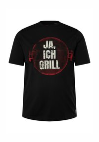 Black t-shirt made of cotton with a round neckline. Features a large red and white graphic reading "JA, ICH GRILL" in distressed font.