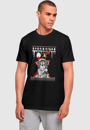 Black cotton t-shirt featuring a colorful, knitted-style graphic of cartoon characters Tom and Jerry in a winter scene.