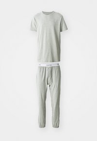 Lichtgrijze katoenen t-shirt met ronde hals en logo op de borst, gecombineerd met bijpassende sweatpants met een elastische tailleband.