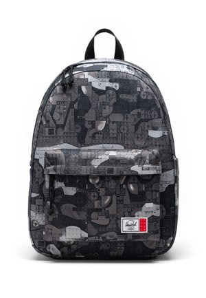 Sac à dos noir et gris avec un motif géométrique rappelant des briques LEGO, poche avant zippée, poignée noire et écusson blanc du logo Herschel.