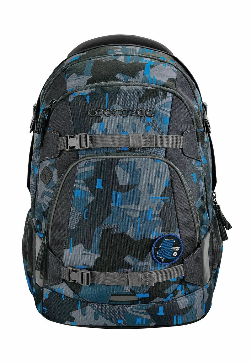 Backpack with a dark, camo pattern in shades of blue and gray, featuring adjustable straps, zippers, and a front logo patch. Durable fabric.