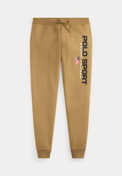 Pantaloni de trening khaki cu talie reglabilă, având un imprimeu lateral cu "POLO SPORT" și steagul american. Material moale și design cu picior tapered.