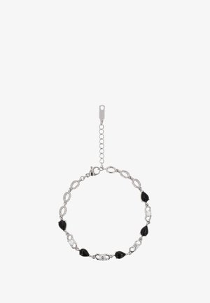 Ezüst lánc karkötő fekete csepp és ovális gyöngyökkel, amelyek között átlátszó kövek találhatóak. Állítható, csattal záródik.