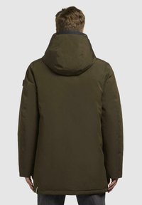 Dark green, insulated parka jacket with a large hood. Features a smooth texture, straight cut, and adjustable hem. Simple, functional design.