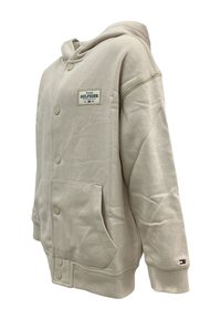 Felpa beige chiaro in misto cotone, con tasca frontale, chiusura con bottoni e una patch con logo sulla parte superiore sinistra. Manicotti a costine inclusi.