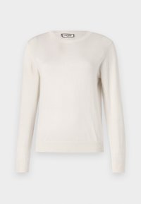 Maglione lungo beige chiaro a maniche lunghe con colletto a giro, realizzato in morbido tessuto a maglia. Polsini e orlo a coste, texture liscia, design minimal.