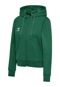 Haut de hoodie zippé vert en tissu doux, avec une capuche à cordon de serrage, des poches kangourou et un logo sur le coin supérieur gauche.