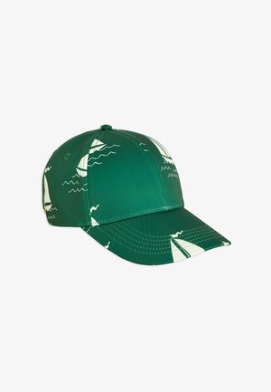 Green baseball cap featuring a pattern of white sailboats and waves. Made from smooth fabric with a curved brim and stitched detailing.