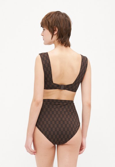 Brown two-piece swimsuit featuring a geometric pattern, thick straps, and a low back design. High-waisted bottom with similar print.
