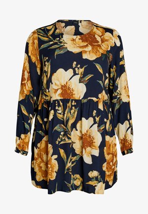 Florale Tunika mit langen Ärmeln in Marineblau, verziert mit großen gelben und cremefarbenen Blumen mit grünen Blättern auf einem strukturierten Stoff. Rundhalsausschnitt.