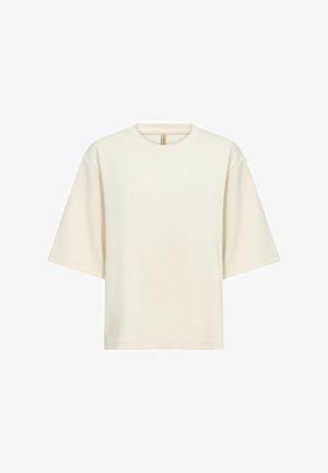 Kermainen ylisuurentekoinen t-paita, joka on valmistettu pehmeästä puuvillasta. Siinä on pyöreä kaulus, lyhyet leveät hihat ja rento siluetti. Ei kuvioita tai koristeluja.