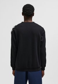 Hummel ARCHIVE PEANUTS - Sudadera - black