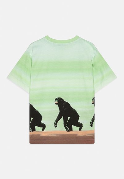 Kortermet grønn gradientgenser med svarte apegrafikker som går på en brun horisontal linje langs bunnen.