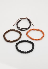 Set of four bracelets: brown wooden beads, black matte beads, orange oval beads, and a braided brown leather band with a sliding knot.