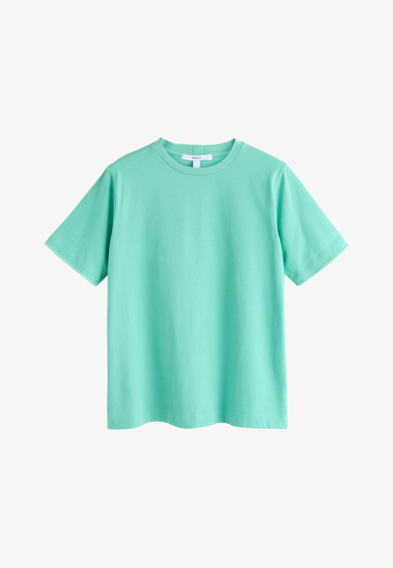 T-shirt uni à manches courtes avec col rond en turquoise clair, avec étiquette de marque visible au col.