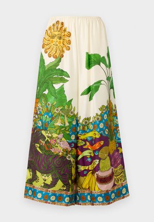 Jupe large et colorée arborant un imprimé tropical vibrant, une taille élastique et des motifs complexes de plantes, d'animaux et de fruits.