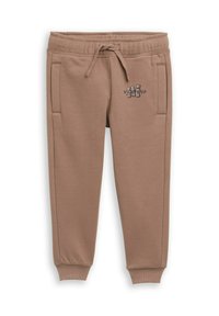Bruine joggingbroek gemaakt van zachte stof, met zijzakken, een elastische tailleband met koord en een kleine grafische tekst aan de voorkant.