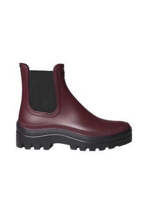 Burgundy rubber Chelsea boot with black elastic side panels, textured upper, and a chunky black sole featuring deep grooves for traction.