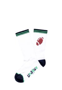Calcetines deportivos blancos con puños a rayas verdes y azul marino, con un gráfico de fútbol rojo y el logo "Unabux" en verde en el pie.