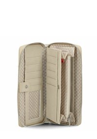 Portafoglio in pelle beige aperto per mostrare più slot per carte, una tasca con zip per monete e una foderatura interna in tessuto con motivo floreale.
