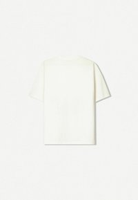 Short-sleeved, crew-neck t-shirt in off-white, made of soft cotton fabric with a smooth texture; no visible patterns or designs.