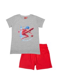 Gray cotton t-shirt featuring a graphic design of a character in a red costume kicking a black ball, paired with red cotton shorts.