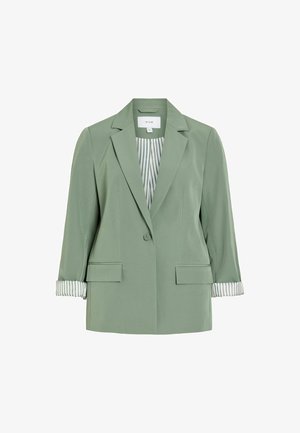 Világoszöld női blézer egysoros gombbal, bevágott gallérral, lenyíló zsebekkel és csíkos mandzsettabéléssel, amely a felhajtott ujjakon látható.