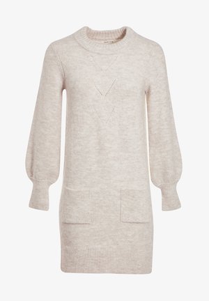 Robe en tricot beige clair avec un col rond, des manches ballon, deux poches avant et des détails de dentelle en forme de diamant. Texture douce.