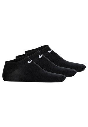 Tres pares de calcetines negros de corte bajo con un pequeño logotipo blanco en el tobillo, dispuestos uno al lado del otro sobre un fondo blanco.