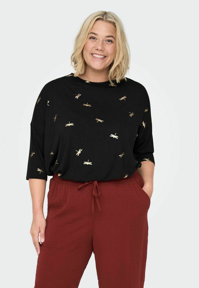Coated leggins med slids fra Carmakoma