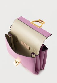 Structured handbag in pink leather with a gold hardware clasp. Interior features light beige lining and a brand label. Divided compartment design.