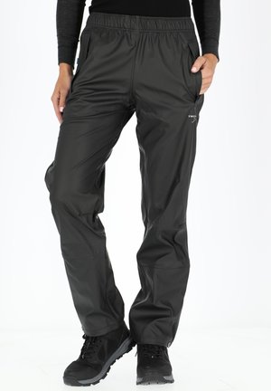 Black waterproof pants featuring an elastic waistband, side pockets, and a smooth texture, designed for outdoor activities.