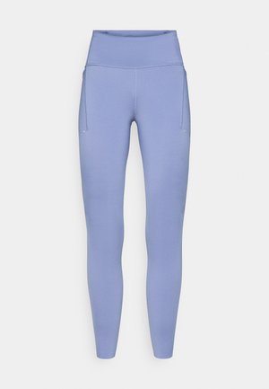 Leggings de cintura alta de color púrpura claro, hechos de tela elástica, con una textura suave y un bolsillo lateral. Diseño sin costuras en la cinturilla.