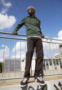 Carhartt WIP PONTIAC PANT MAITLAND - Straight leg jeans - black stone washed
