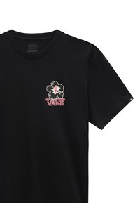 Camiseta de algodón negra con un gráfico floral en blanco y rosa, con la marca "VANS" impresa debajo en un color contrastante. Diseño de corte clásico.