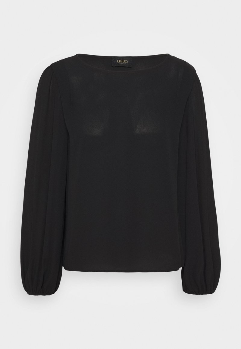 Schwarze Bluse mit langen Ärmeln, geradem Schnitt, runder Halslinie und elastischen Bündchen. Hergestellt aus einem glatten, leicht durchscheinenden Stoff.