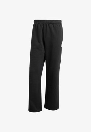 Black sweatpants with an elastic waistband, straight legs, and a small white logo on the lower side. Made from soft, textured fabric.
