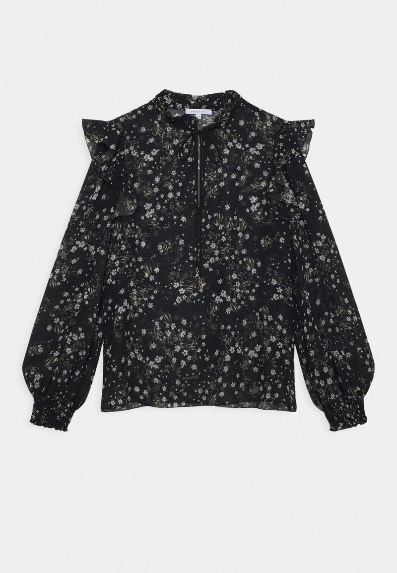 Blouse noire à motifs floraux avec des épaules volantées, des manches longues bouffantes, un décolleté en forme de clé et de délicats motifs floraux blancs et verts tout au long.