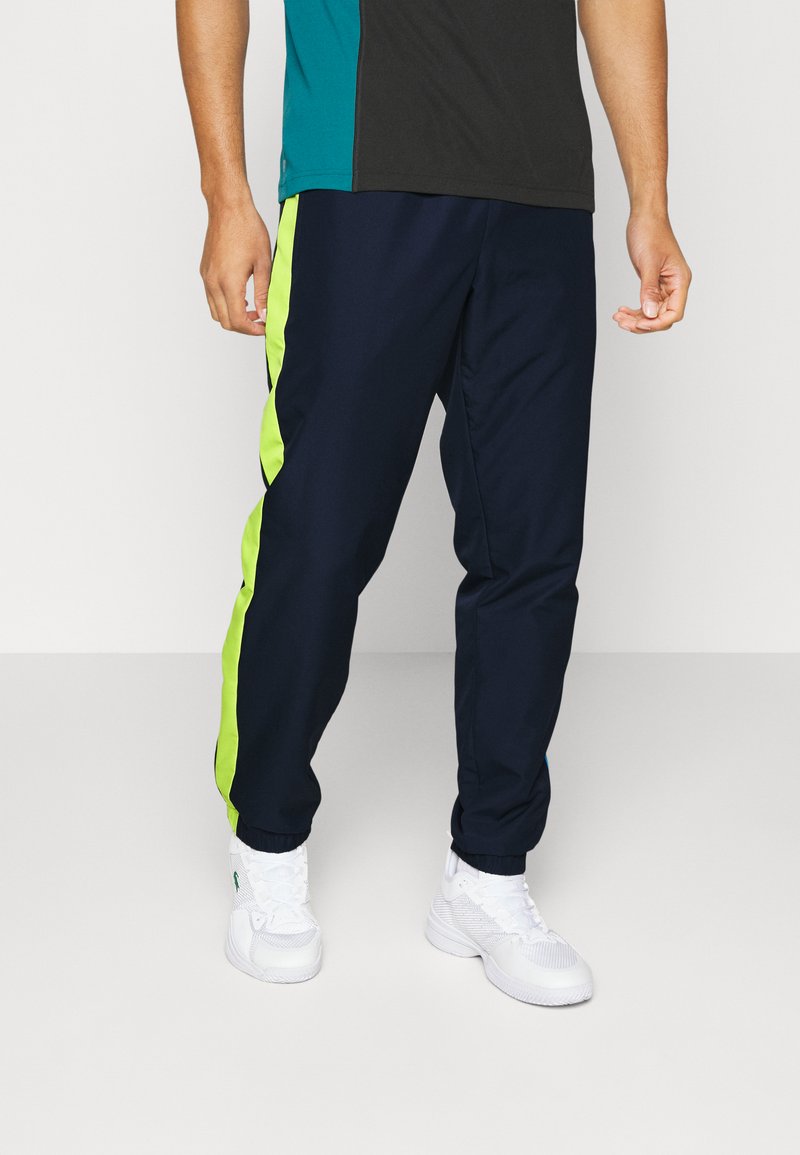 Lacoste Sport TENNIS PANT BLOCK Tracksuit bottoms navy blue/lima
