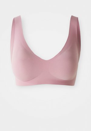 Sutiã sem costuras em rosa claro, sem fios, com alças largas e copas moldadas, projetado para conforto e um ajuste suave.