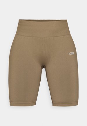 Športne kratke hlače v rjavi barvi z visokim pasom in gladko teksturo, s logotipom na levi nogi in brezšivnimi manšeti na dnu.