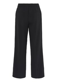 Pantalons larges noirs avec une taille élastique, dotés de deux poches arrière et d'une texture de tissu lisse et léger.