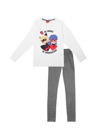 Camicia bianca a maniche lunghe con un design a cartone animato di due personaggi e la scritta "Sii Coraggioso Sii Miracoloso", abbinata a leggings in cotone grigi.